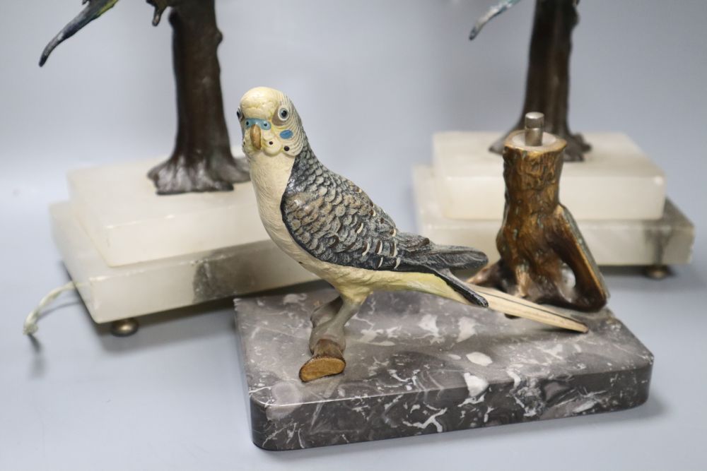 A pair of cold painted metal budgerigar lamps, height 28cm excl. light fitting and a cold painted metal budgerigar table lighter, width